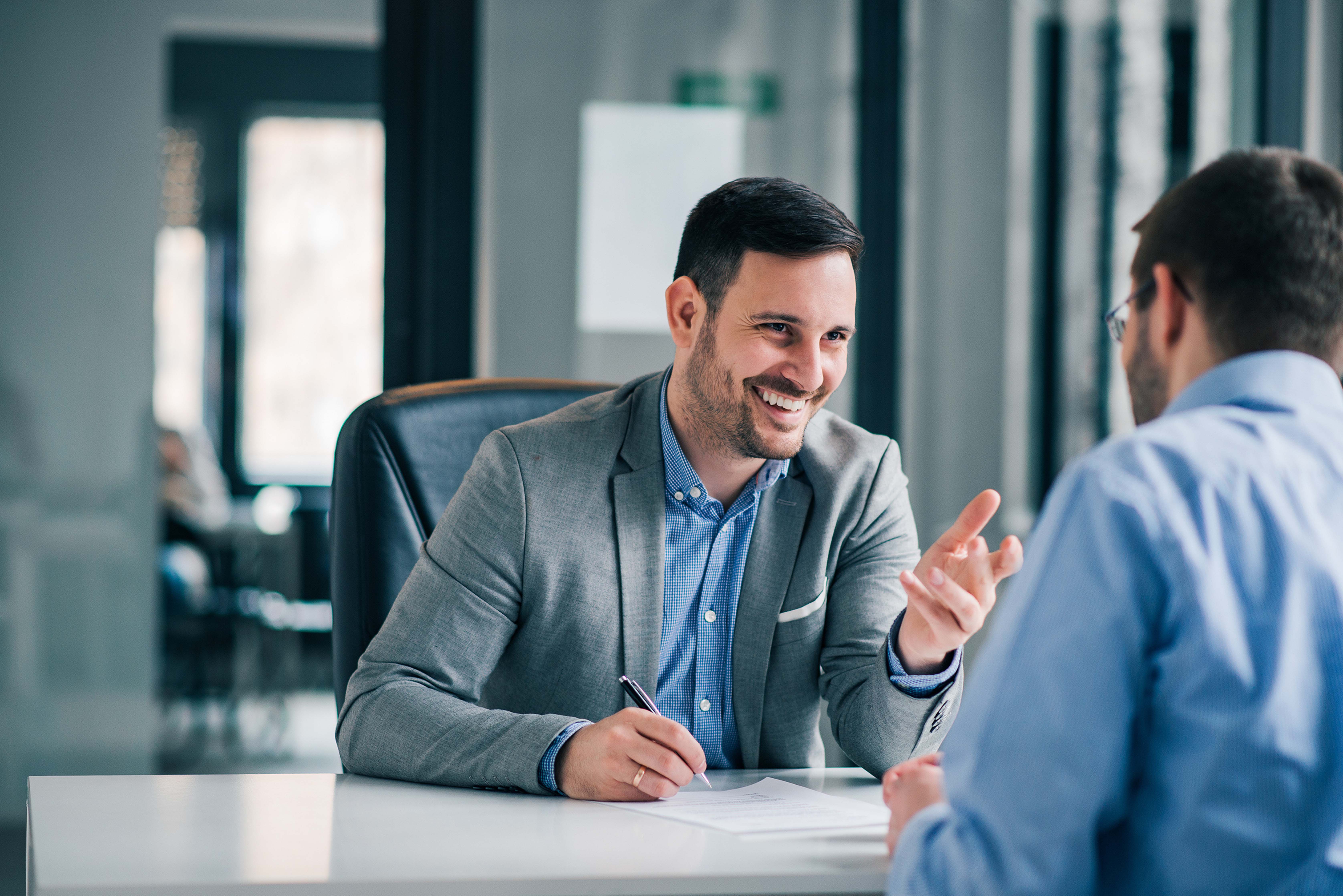 Team leader meeting with an employee to discuss skills development